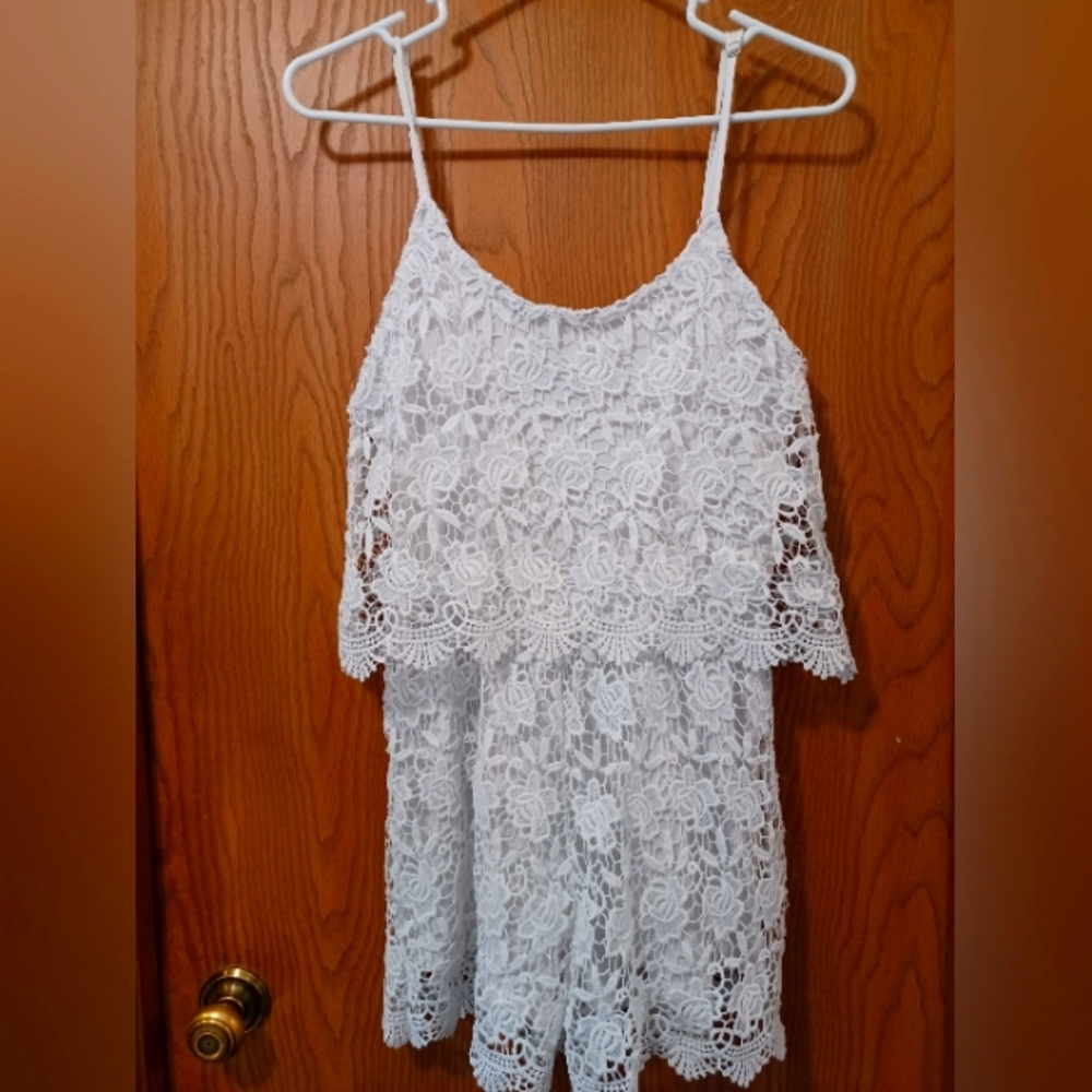 POOF! Floral crochet romper